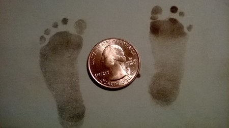 Eli's footprints with a quarter so you can see how teeny.